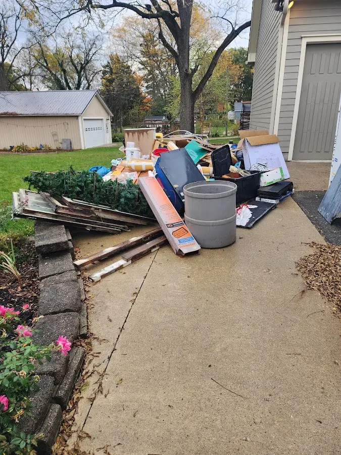 Dumpster being loaded with debris for 12 Yard Dumpster Rental in Jourdanton